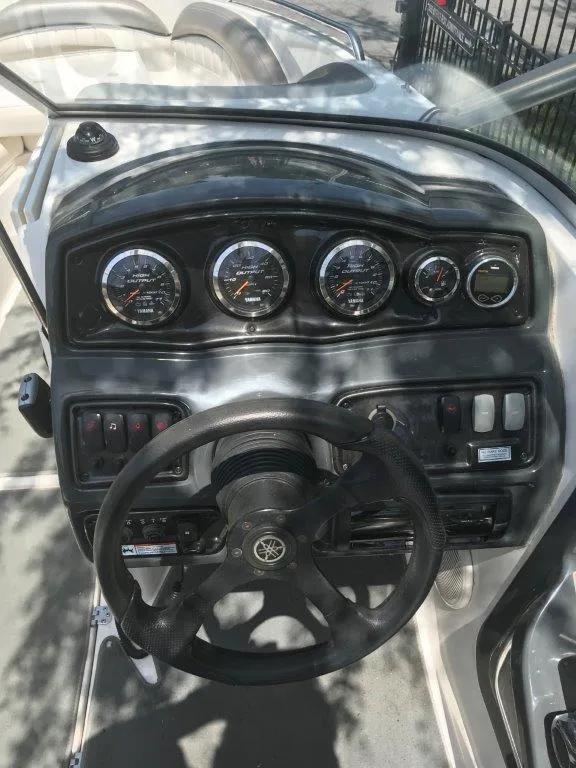 Slide: The Image of 2007 Yamaha Boats AR230 HO dashboard with gauges and steering wheel. - 6