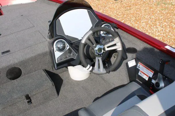 Slide: The Image of 2023 Lowe ST175 boat cockpit with steering wheel and control panel. - 6