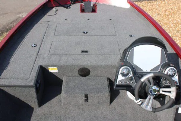 Slide: The Image of 2023 Lowe ST175 boat interior with steering console and storage compartments. - 7