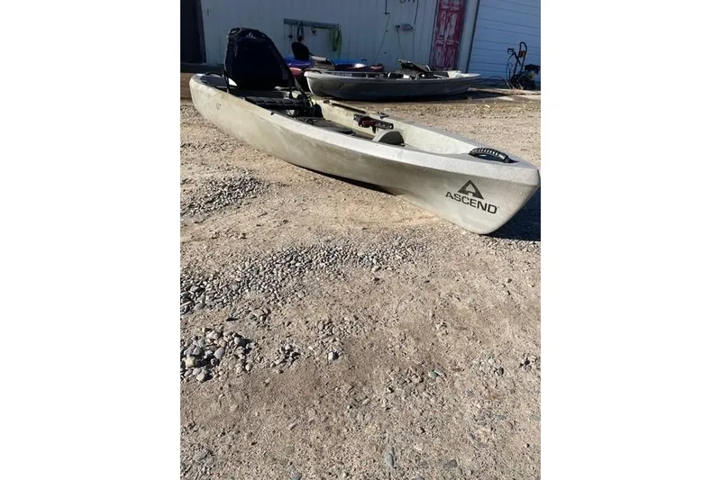 The Image of 2022 Ascend 12T Sit-On kayak in Desert Storm color on gravel surface. - 0
