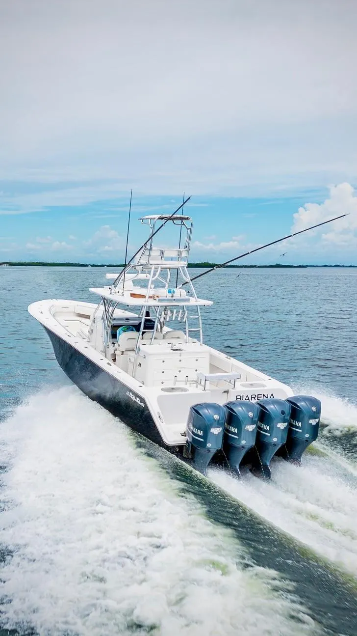 Slide: The Image of 2017 SeaHunter 45 boat cruising on open water with four powerful engines. - 8