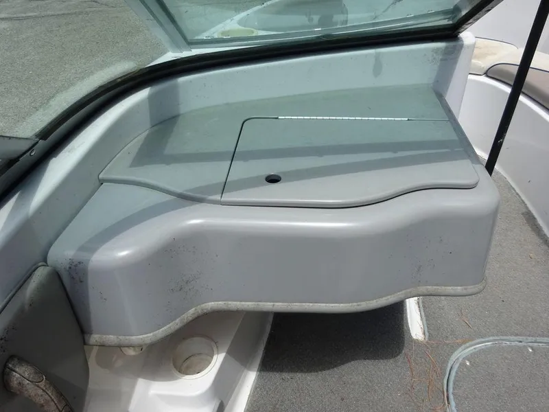 Slide: The Image of 2000 Four Winns 180 Horizon boat interior dashboard and storage compartment. - 14