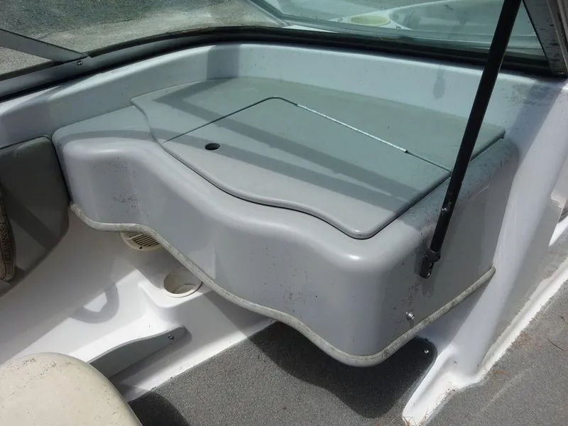 Slide: The Image of 2000 Four Winns 180 Horizon boat interior, gray dashboard and seating area. - 15