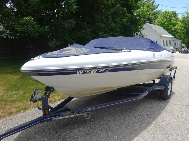 Slide: The Image of 2000 Four Winns 180 Horizon boat on trailer with cover. - 3