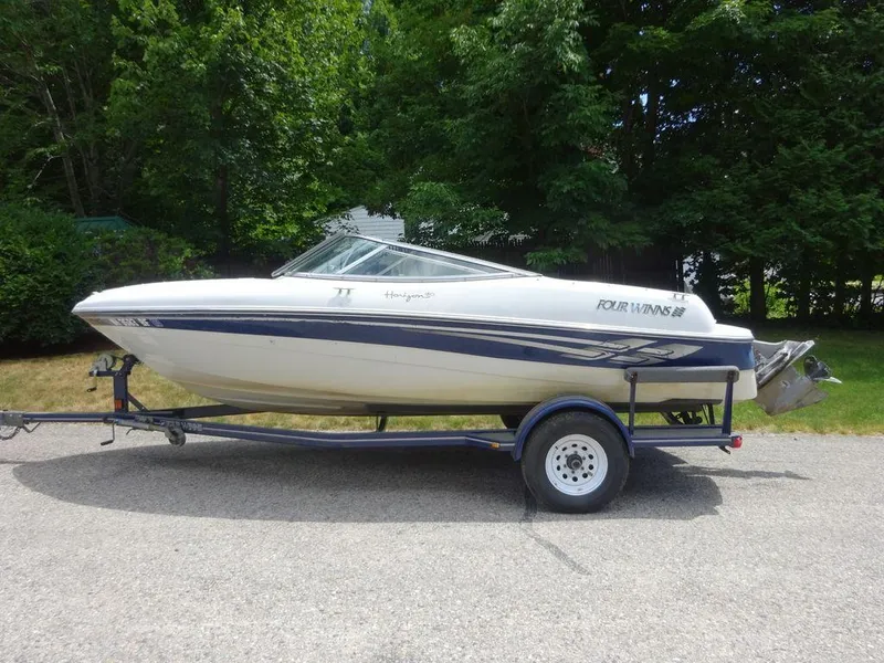 Slide: The Image of 2000 Four Winns 180 Horizon boat on trailer, side view. - 4