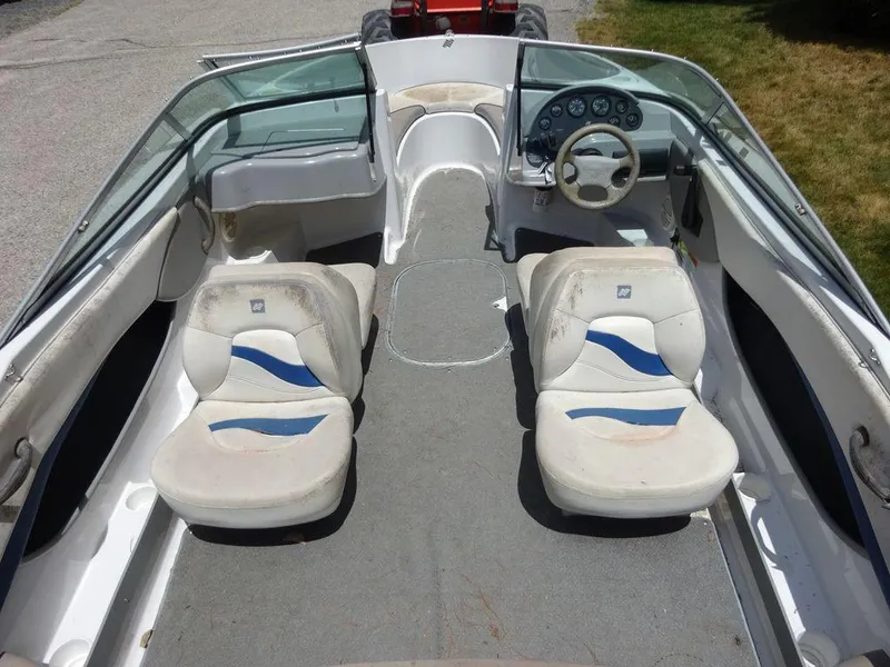 Slide: The Image of 2000 Four Winns 180 Horizon boat interior with seating and dashboard. - 7