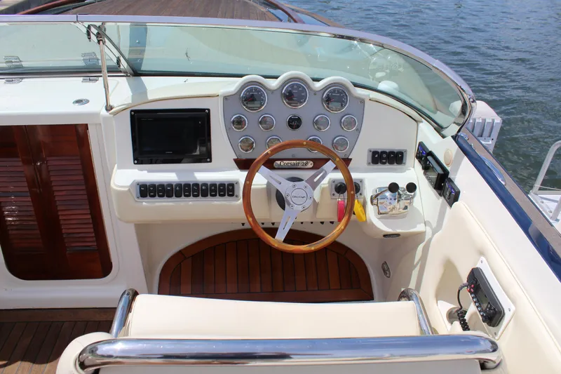 Slide: The Image of Cockpit of a 2010 Chris-Craft Corsair 28 with wooden steering wheel. - 12