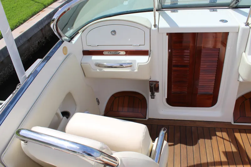 Slide: The Image of Interior of a 2010 Chris-Craft Corsair 28 with wooden flooring. - 13