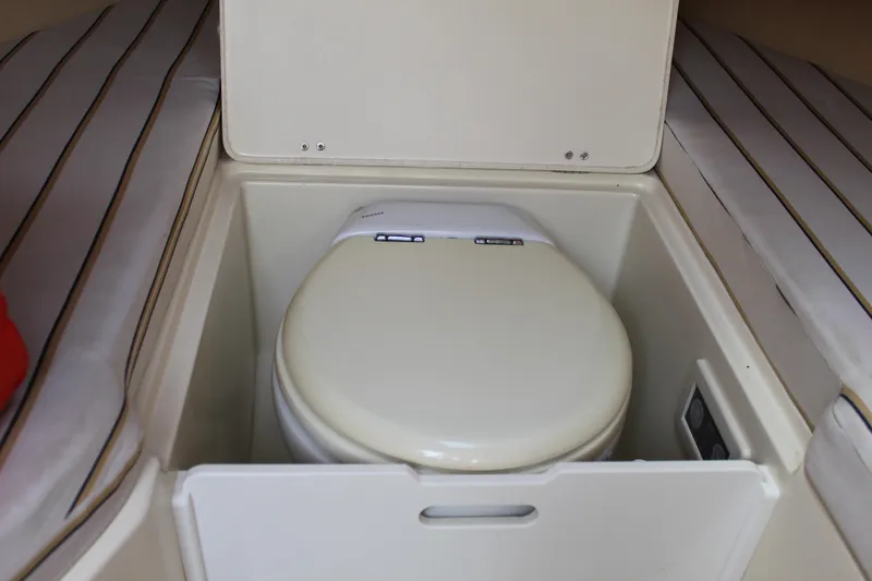 Slide: The Image of 2010 Chris-Craft Corsair 28 boat toilet in cabin interior. - 15