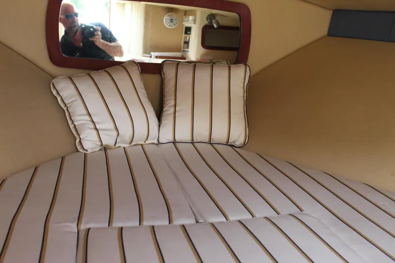 Slide: The Image of Interior of 2010 Chris-Craft Corsair 28 with striped upholstery. - 16