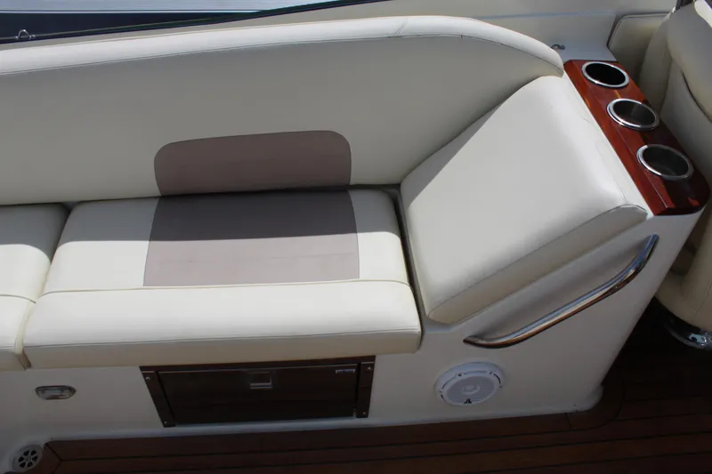 Slide: The Image of Interior of 2010 Chris-Craft Corsair 28 with beige seating and cup holders. - 7