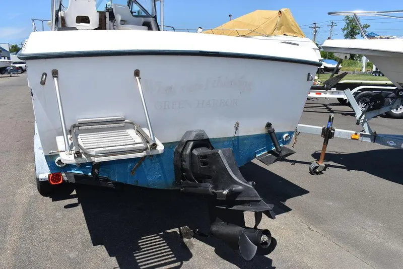 Slide: The Image of 1987 Grady-White Offshore 24 boat stern with outboard motor and swim platform. - 10