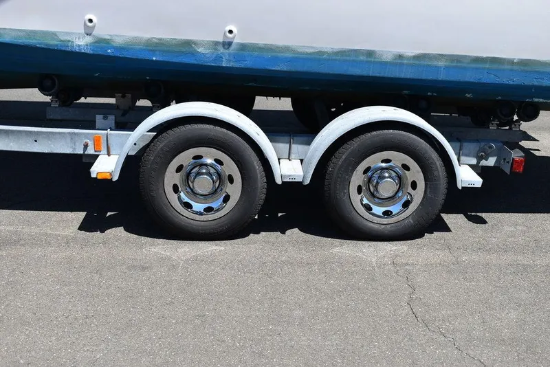 Slide: The Image of 1987 Grady-White Offshore 24 boat on a dual-axle trailer. - 15