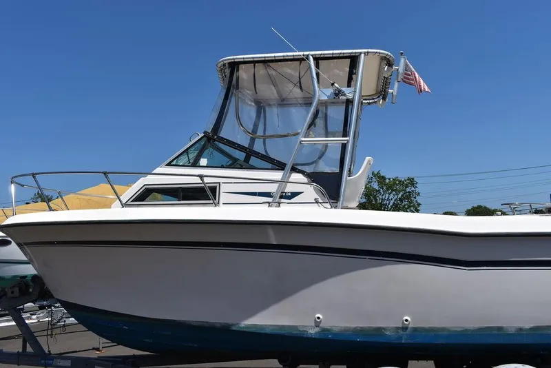 Slide: The Image of 1987 Grady-White Offshore 24 boat with hardtop and American flag. - 17