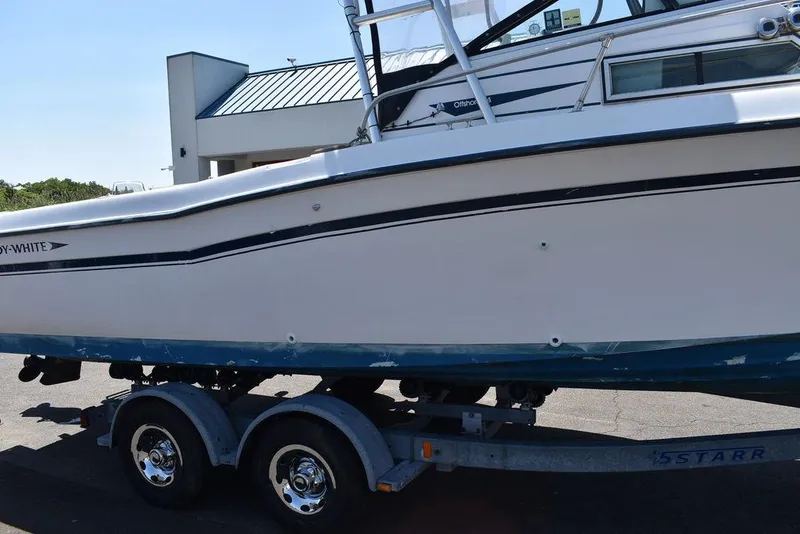 Slide: The Image of 1987 Grady-White Offshore 24 boat on a trailer, side view. - 23
