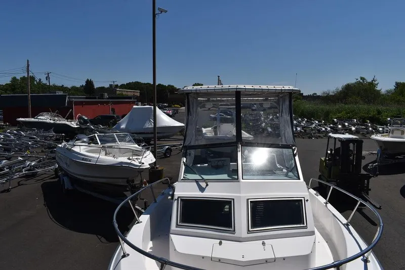 Slide: The Image of 1987 Grady-White Offshore 24 boat in a marina, front view. - 29