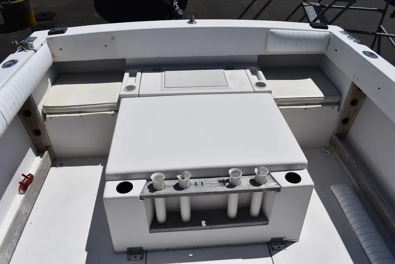 Slide: The Image of 1987 Grady-White Offshore 24 boat deck with seating and rod holders. - 37