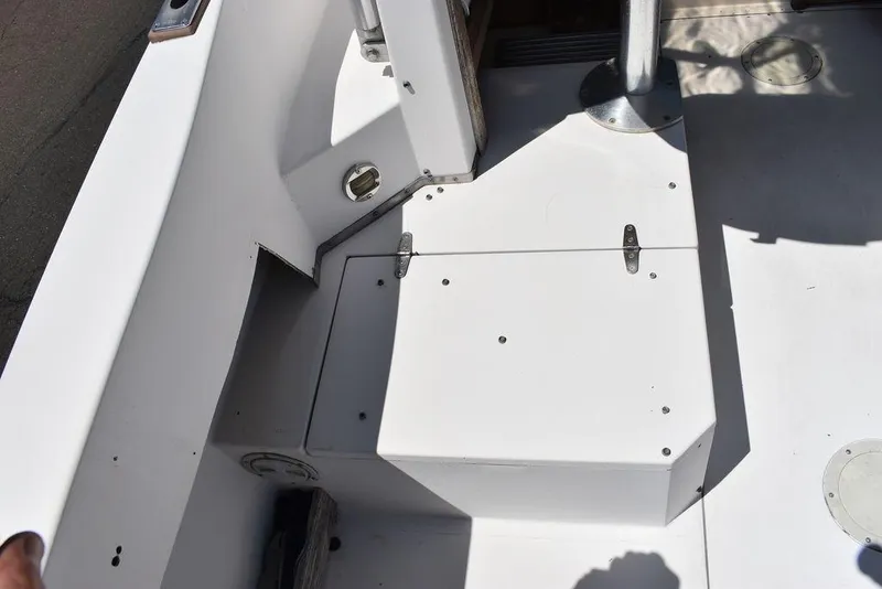 Slide: The Image of 1987 Grady-White Offshore 24 boat deck with storage compartment. - 40