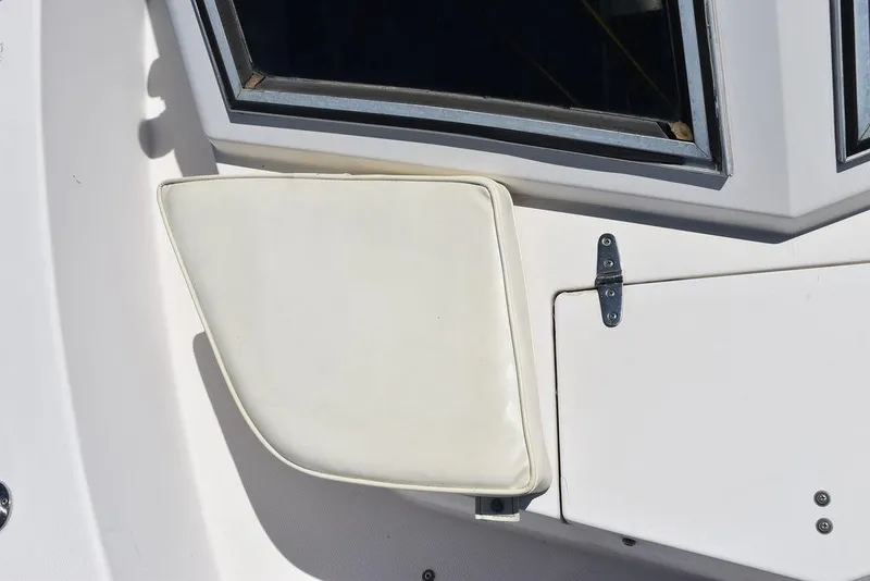 Slide: The Image of 1987 Grady-White Offshore 24 boat interior detail with cushioned panel and window. - 42