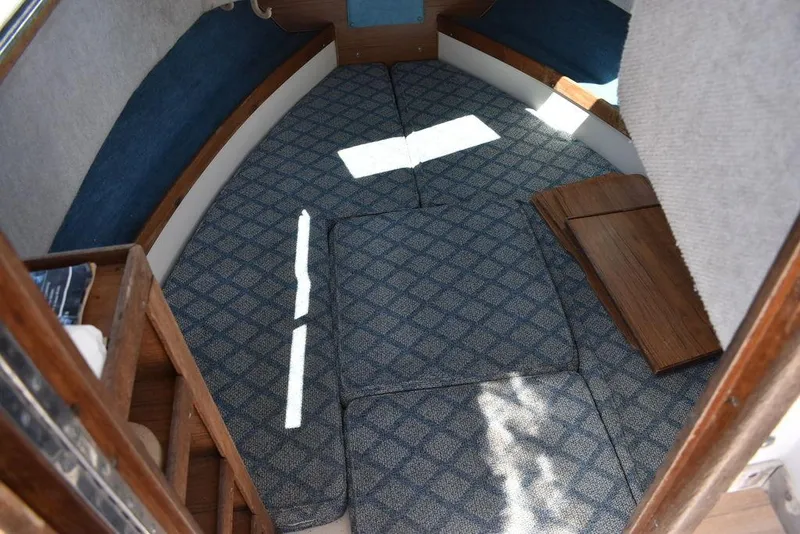 Slide: The Image of Interior cabin of 1987 Grady-White Offshore 24 boat with blue patterned carpet. - 46