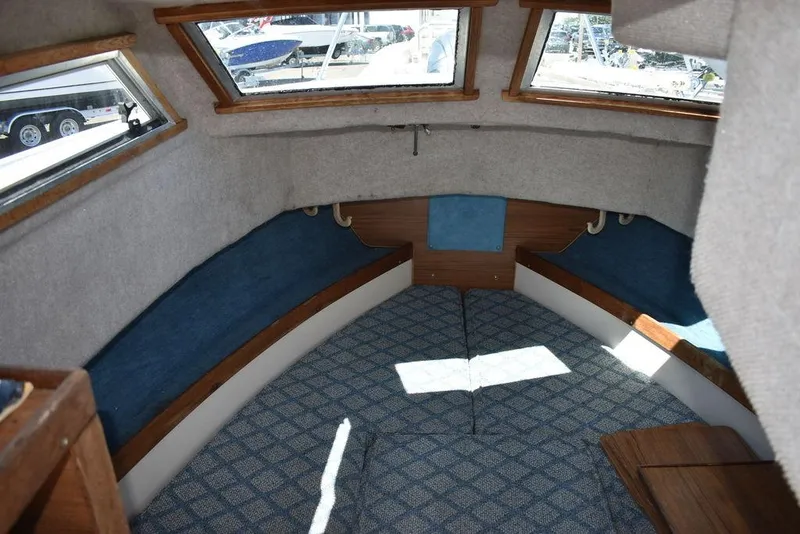 Slide: The Image of Interior cabin of a 1987 Grady-White Offshore 24 boat with blue and white upholstery. - 47