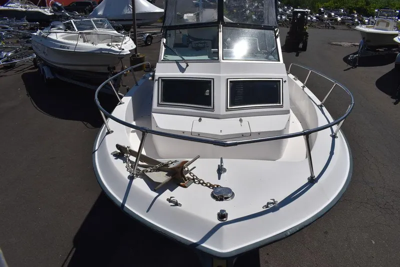 Slide: The Image of 1987 Grady-White Offshore 24 boat, front view, docked in a marina. - 5