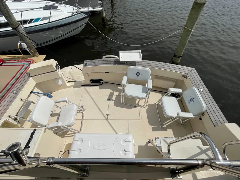 Slide: The Image of 1989 Hi-Star 55 Pilothouse yacht deck with seating and water view. - 3