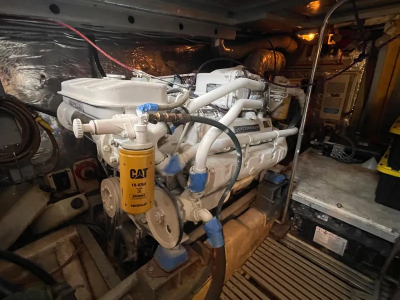 Slide: The Image of Engine room of 1989 Hi-Star 55 Pilothouse with CAT filter and mechanical components. - 33