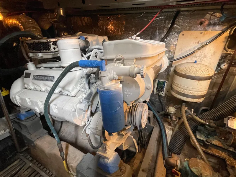 Slide: The Image of Engine room of a 1989 Hi-Star 55 Pilothouse yacht, showcasing mechanical components. - 34