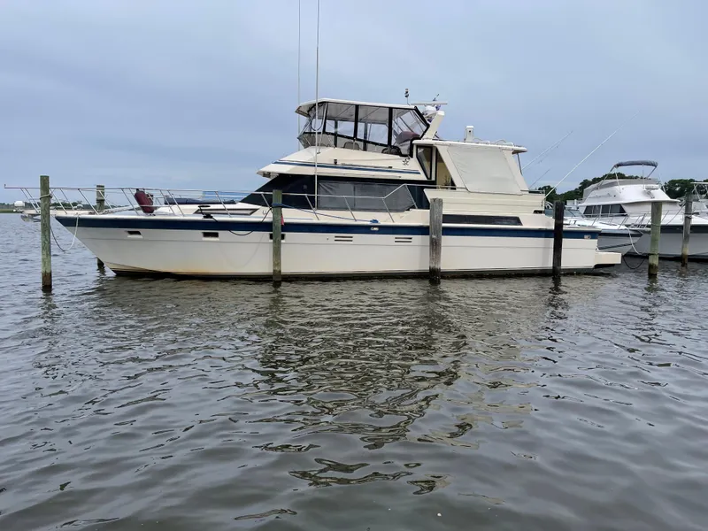 Slide: The Image of 1989 Hi-Star 55 Pilothouse yacht docked on calm water. - 4