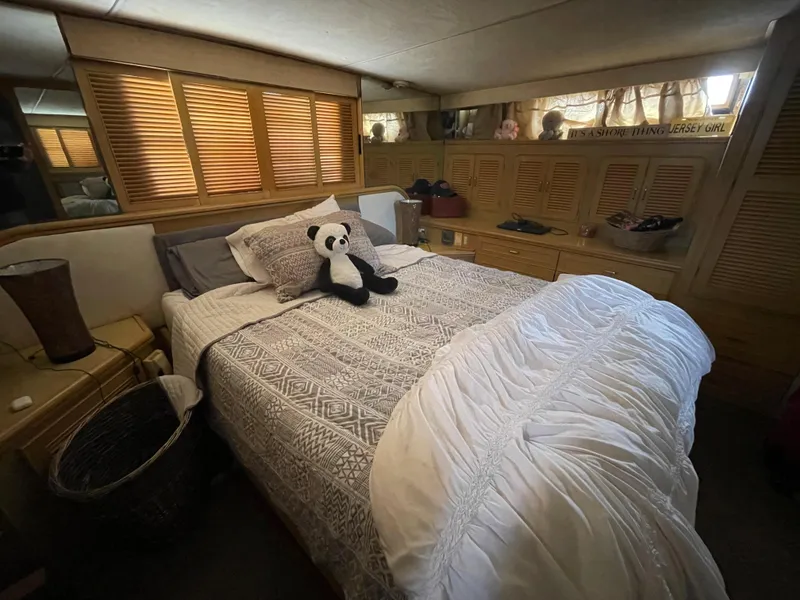 Slide: The Image of Cozy bedroom in 1989 Hi-Star 55 Pilothouse yacht with plush panda on bed. - 5