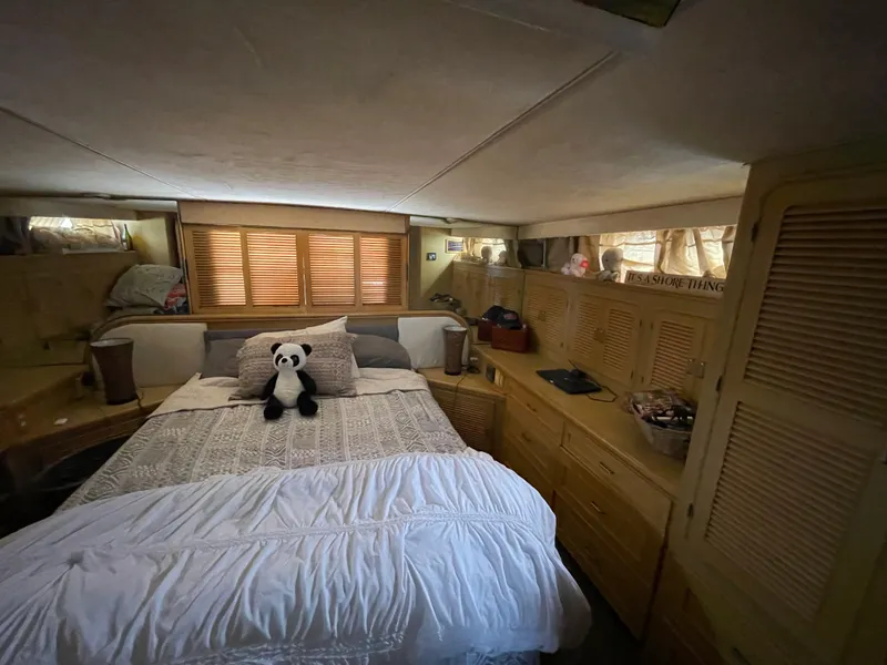Slide: The Image of Cozy bedroom in 1989 Hi-Star 55 Pilothouse yacht with plush panda on bed. - 6