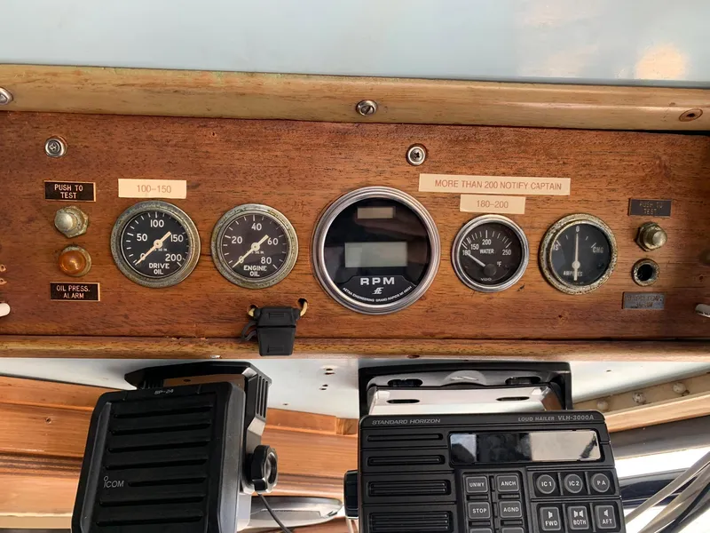 Slide: The Image of Control panel of a 1970 Custom Dive Vessel with gauges and communication equipment. - 10
