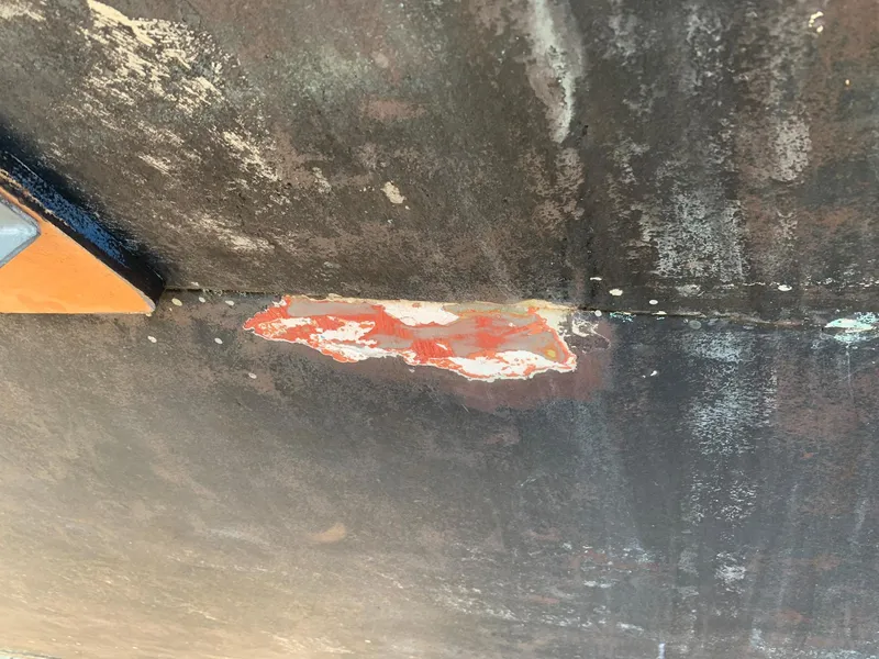 Slide: The Image of Close-up of hull damage on a 1970 Custom Dive Vessel. - 14