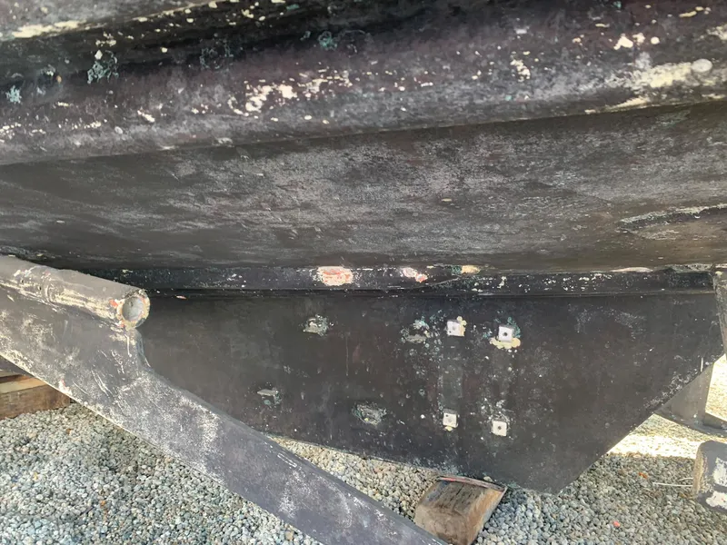 Slide: The Image of Underside of a 1970 Custom Dive Vessel showing wear and tear. - 16