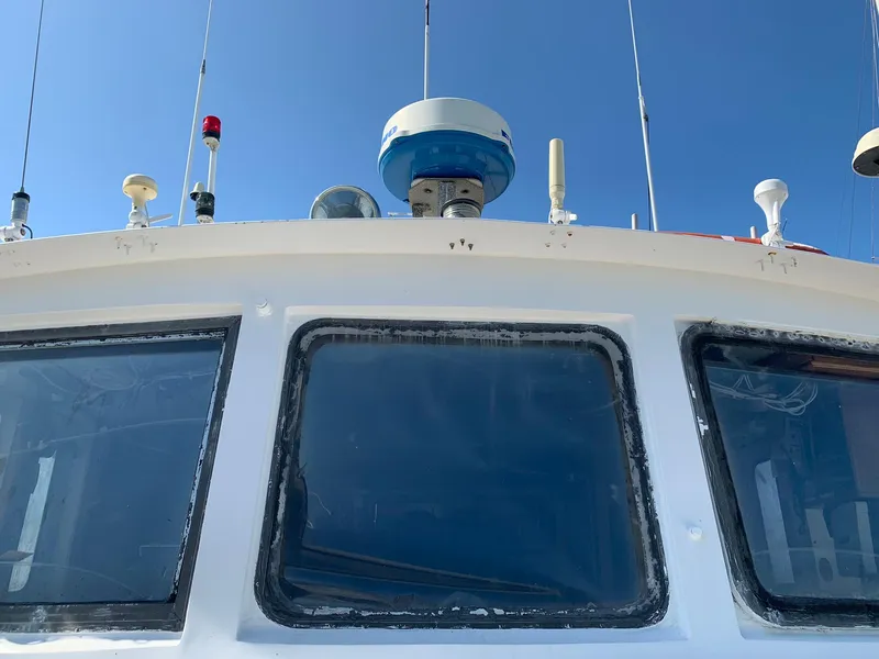 Slide: The Image of 1970 Custom Dive Vessel with navigation equipment and antennas. - 2