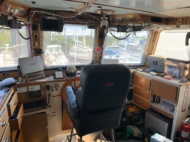 Slide: The Image of Interior of a 1970 custom dive vessel's cockpit with navigation equipment and control panel. - 23