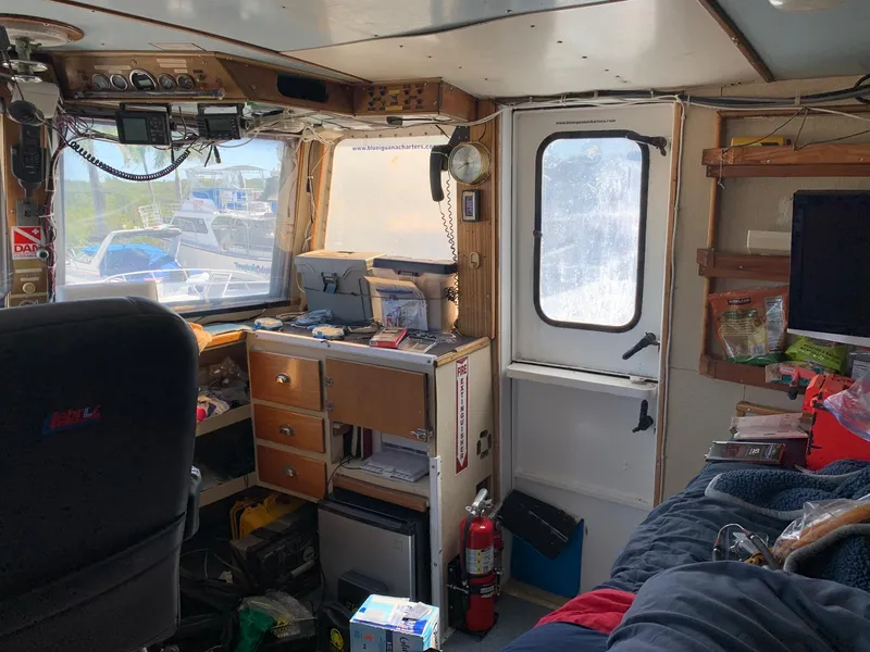 Slide: The Image of Interior of a 1970 custom dive vessel with navigation equipment and storage. - 24