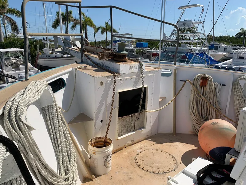 Slide: The Image of 1970 Custom Dive Vessel deck with ropes, anchor chain, and marine equipment. - 25