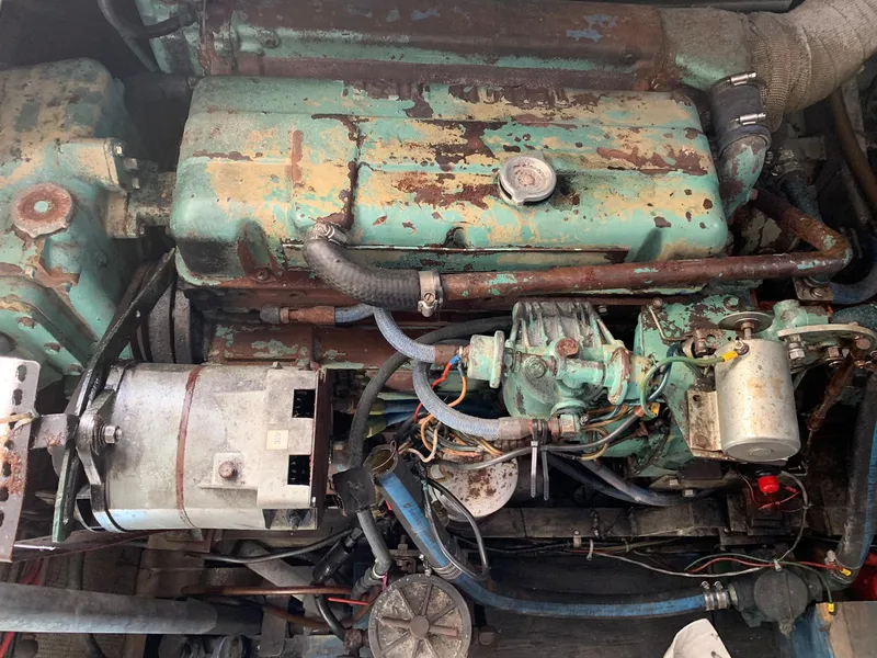 Slide: The Image of 1970 Custom Dive Vessel engine with visible wear and rust. - 29