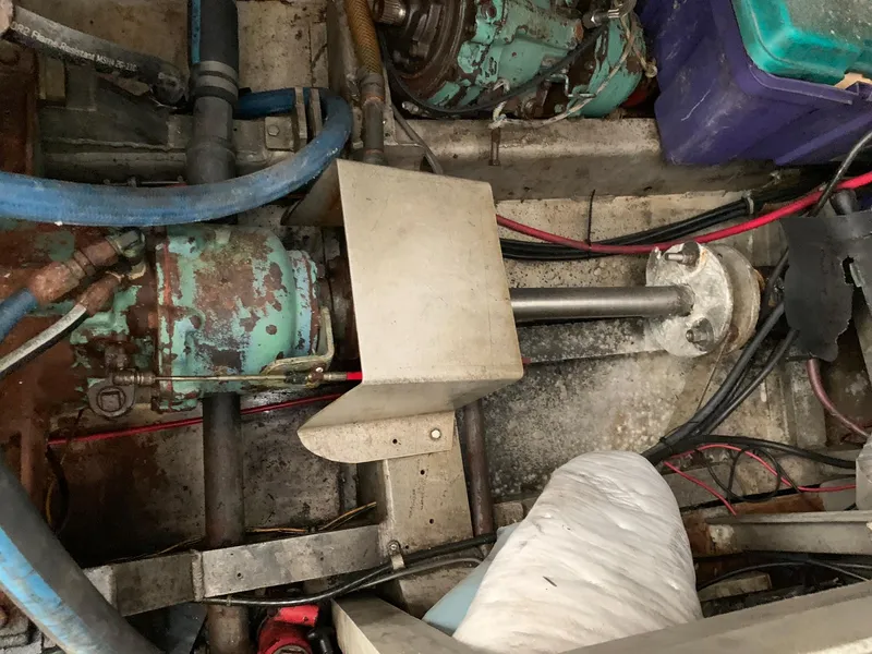 Slide: The Image of Engine room of a 1970 Custom Dive Vessel with visible machinery and wiring. - 30