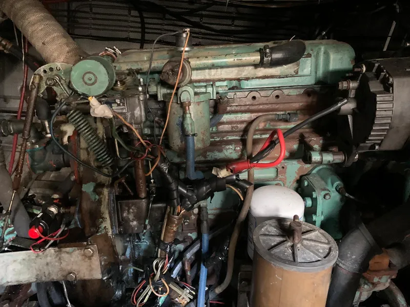 Slide: The Image of 1970 Custom Dive Vessel engine room with complex machinery and wiring. - 31