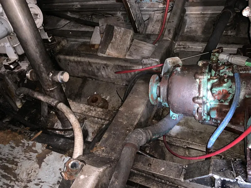 Slide: The Image of Engine room of a 1970 custom dive vessel with visible pipes and machinery. - 33