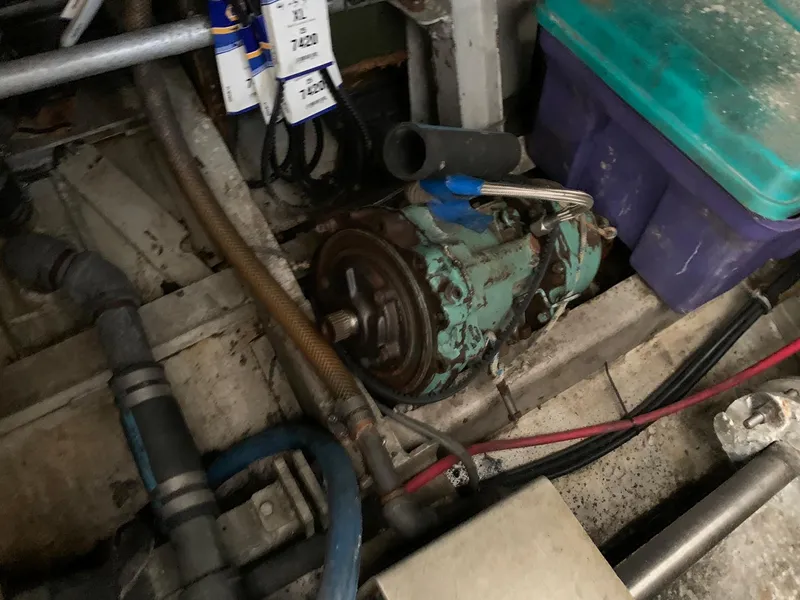 Slide: The Image of Engine compartment of a 1970 Custom Dive Vessel with various mechanical components. - 34