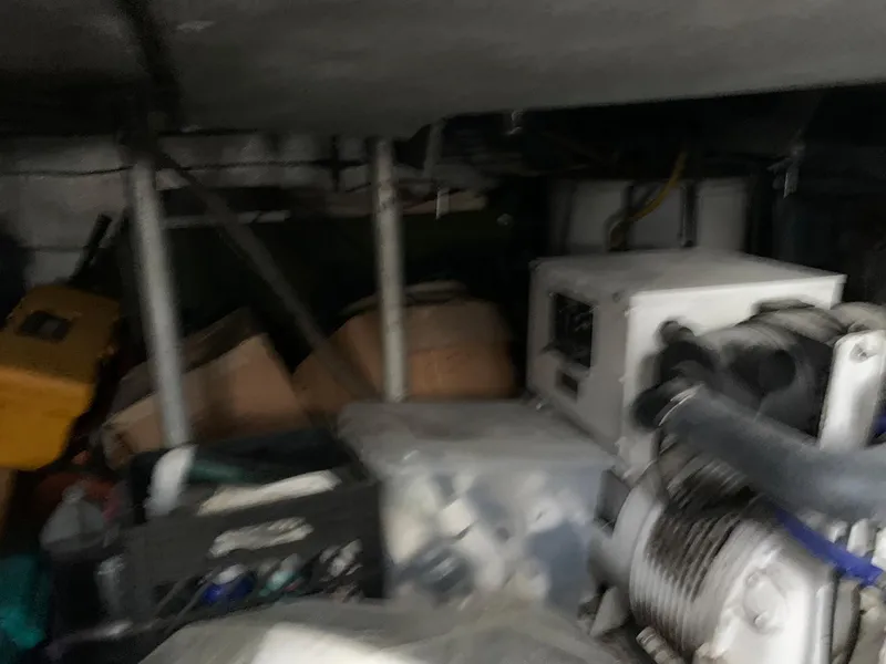 Slide: The Image of Engine room of a 1970 Custom Dive Vessel with equipment and machinery. - 36