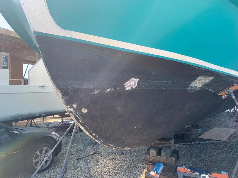 Slide: The Image of 1970 Custom Dive Vessel hull under maintenance on dry dock. - 4