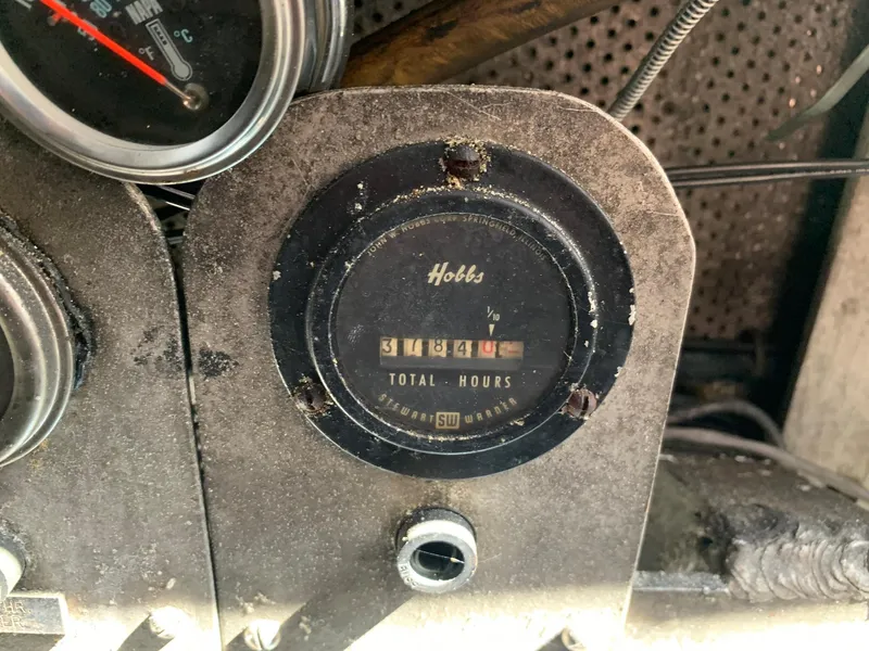 Slide: The Image of Vintage Hobbs hour meter on a 1970 custom dive vessel dashboard. - 40