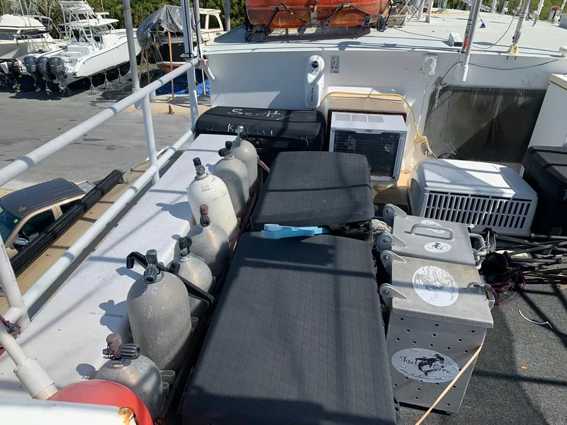 Slide: The Image of 1970 Custom Dive Vessel deck with scuba tanks and equipment. - 42