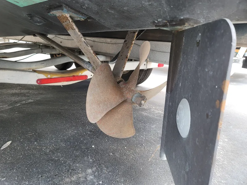 Slide: The Image of Propeller and rudder of a 1989 C-Hawk 29 boat on a trailer. - 11