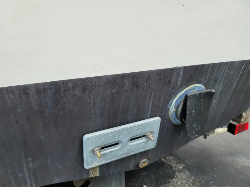 Slide: The Image of Close-up of the stern of a 1989 C-Hawk 29 boat showing a zinc anode. - 13